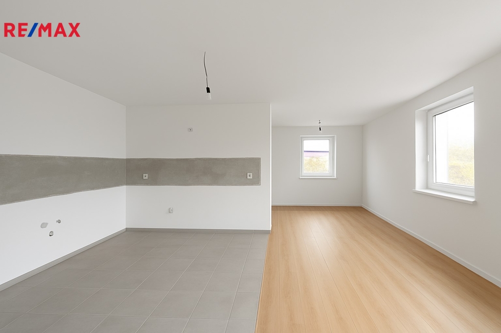 1NP - Obývací místnost + jídelnou a kuchyní