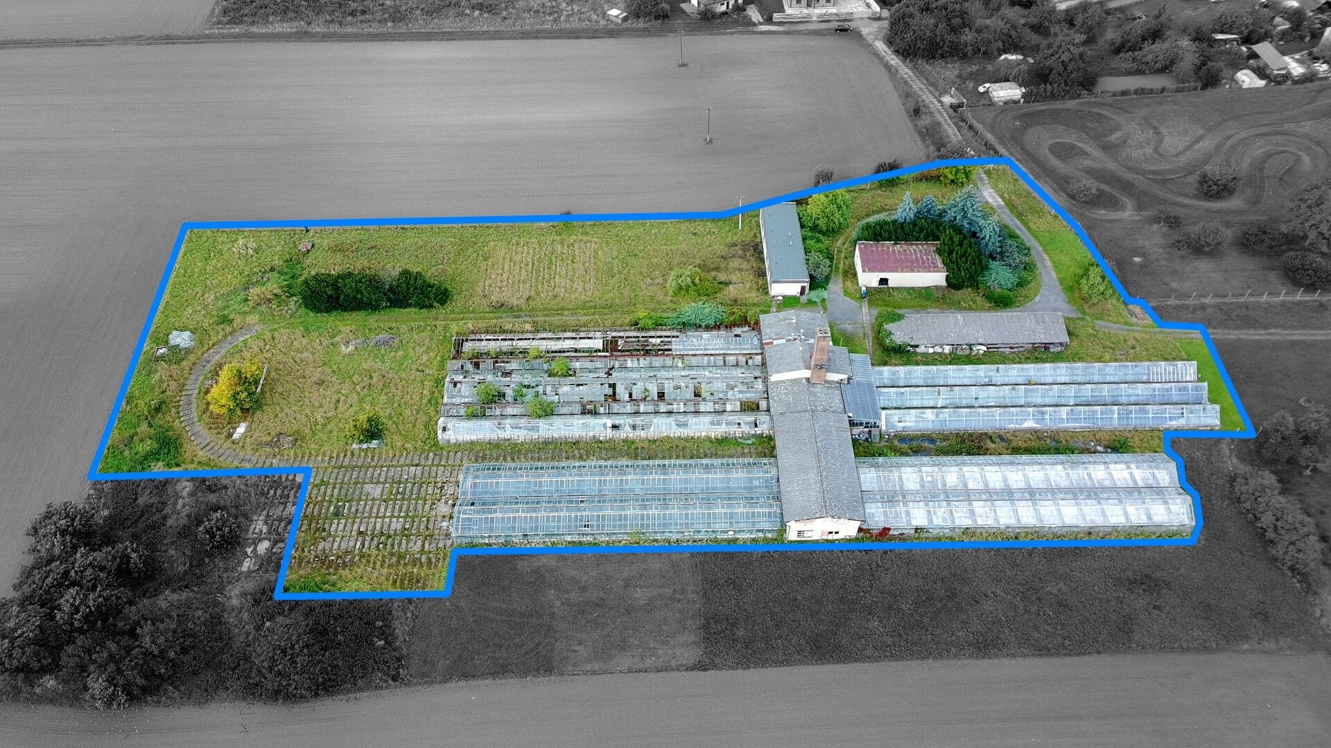 Pozemky o výměře 11.704 m2 v Holicích (bývalý zemědělský areál)