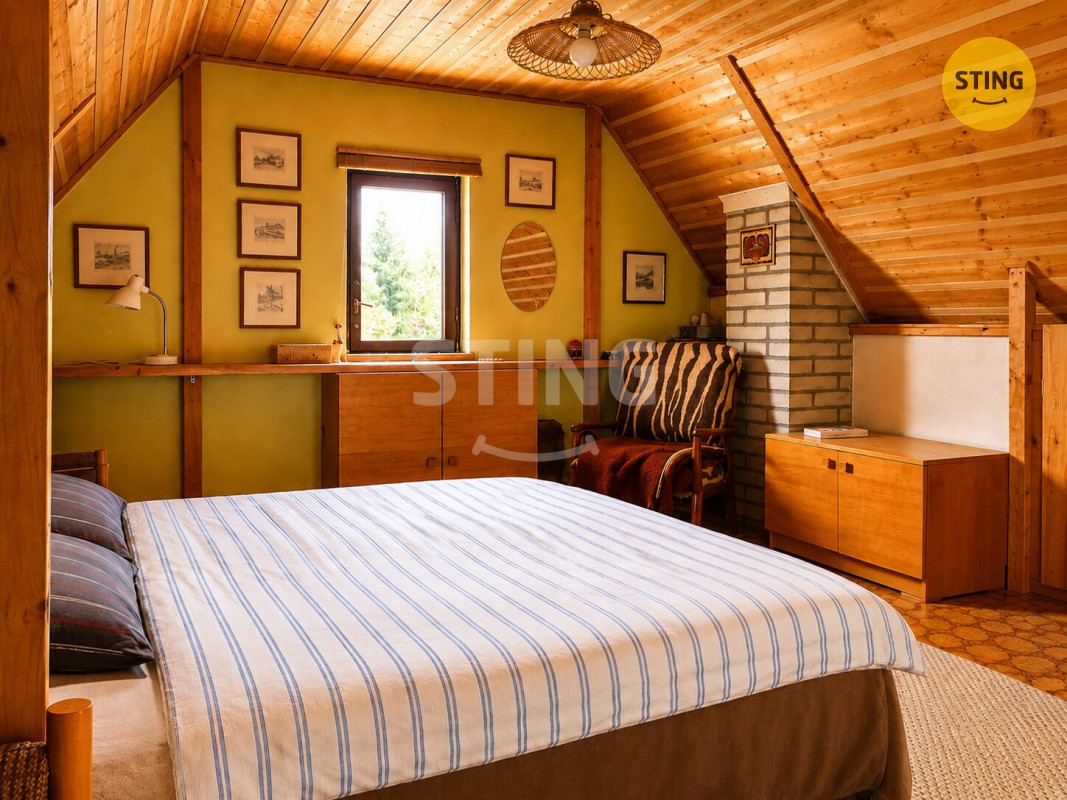 a_cozy_attic_bedroom_scene_warm_and_well_lit_inte.jpg