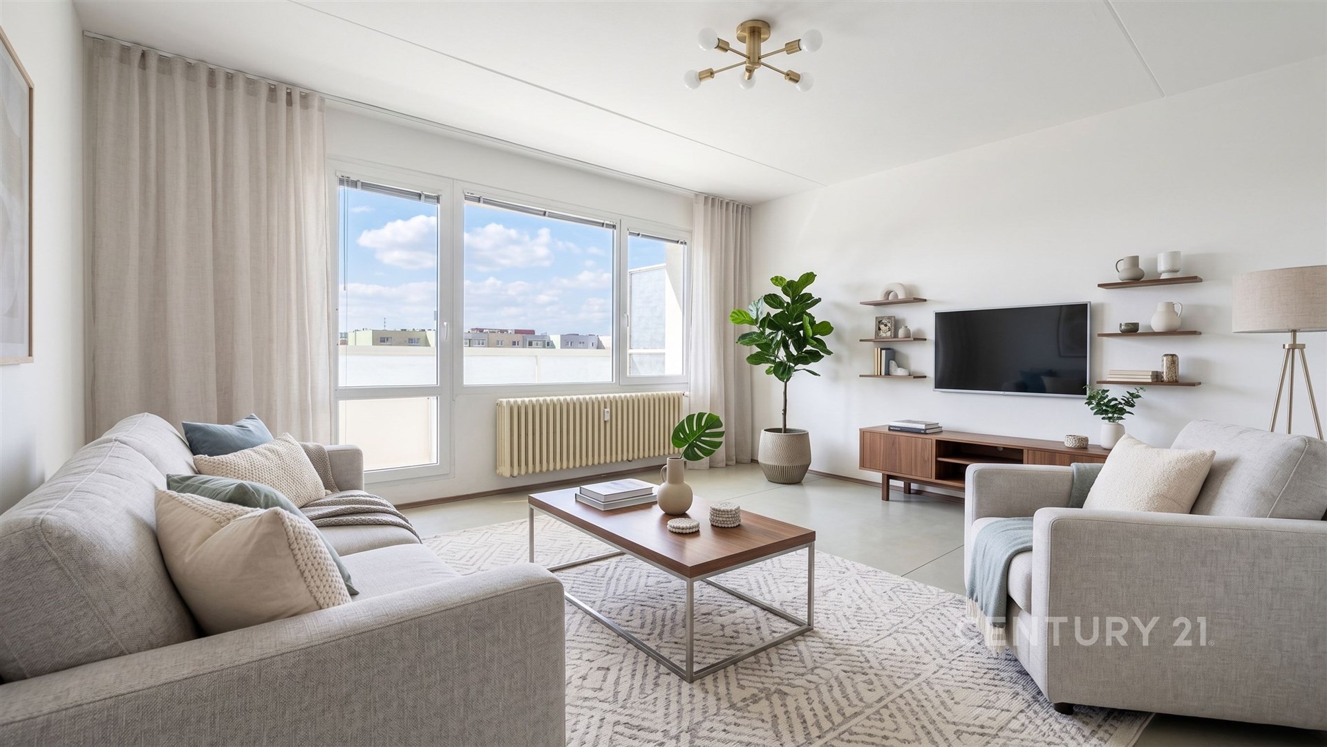 Světlý obývací pokoj s parketovou podlahou, velká okna, moderní design, útulná sedací souprava a stylové osvětlení, včetně dekorativní rostliny.
